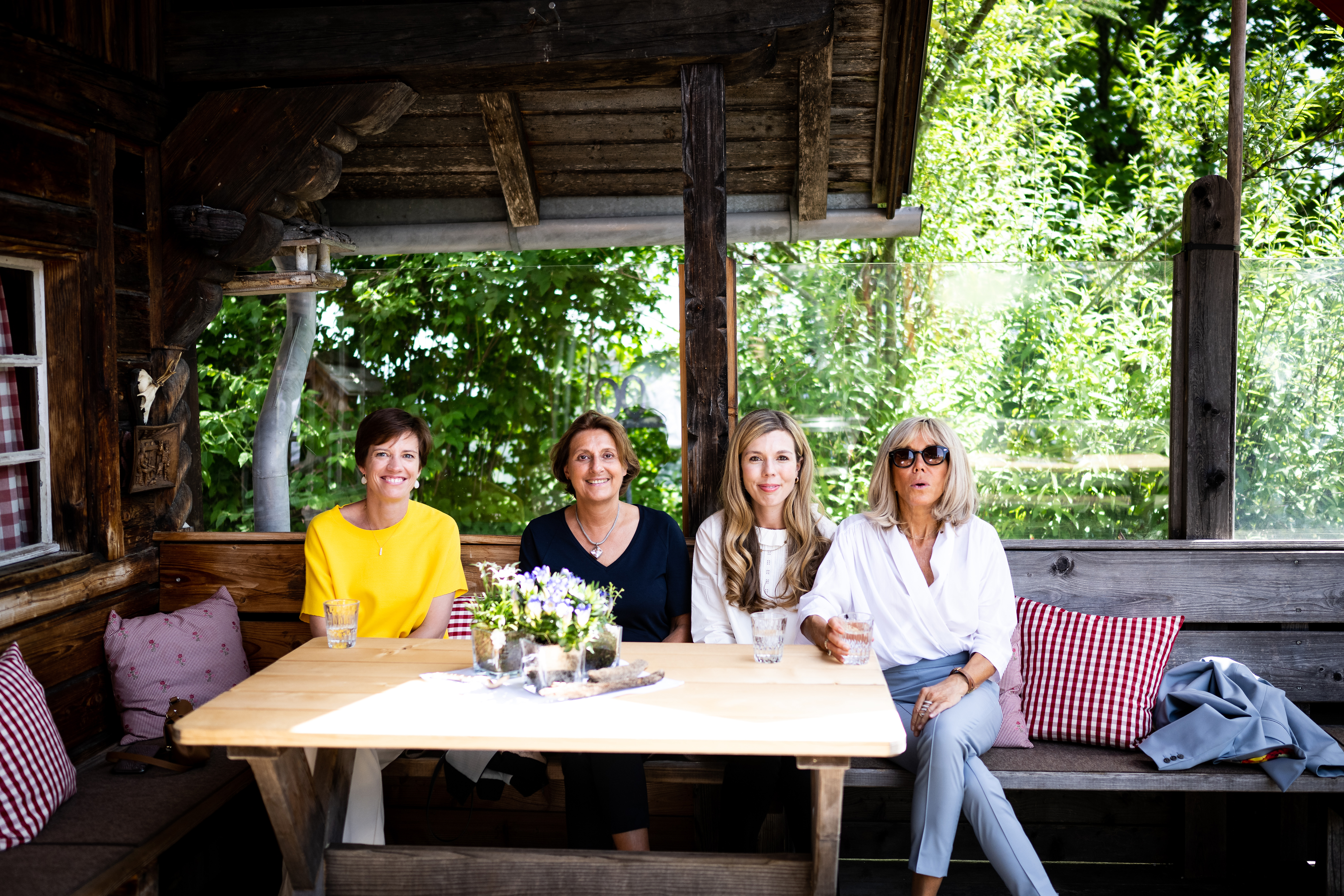 Amélie Derbaudrenghien, Britta Ernst, Carrie Johnson and Brigitte Macron in the Elmauer Alm mountain restaurant.