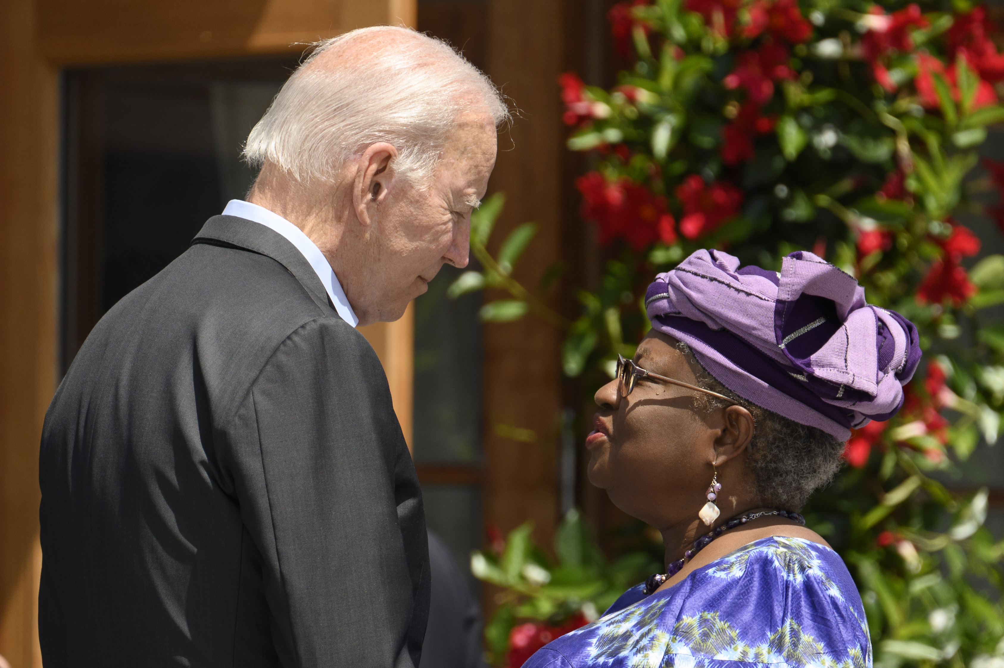 Director-General of the World Trade Organization Ngozi Okonjo-Iweala speaking with US President Joe Biden at the official welcome of the G7 outreach partners.
