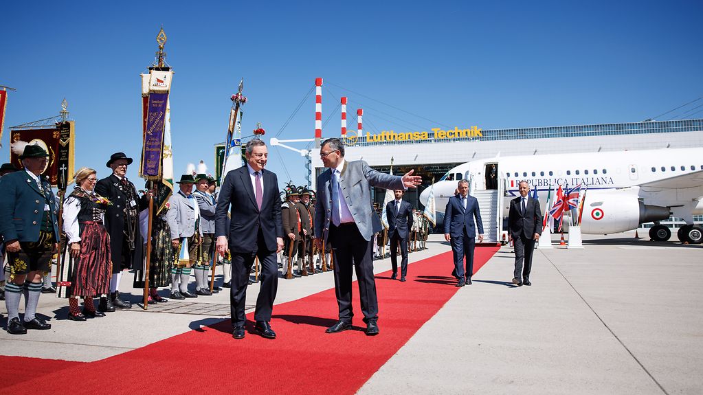 Mario Draghi (Prime Minister of Italy) being welcomed by Florian Herrmann, Head of the Bavarian State Chancellery, at Munich Airport.
