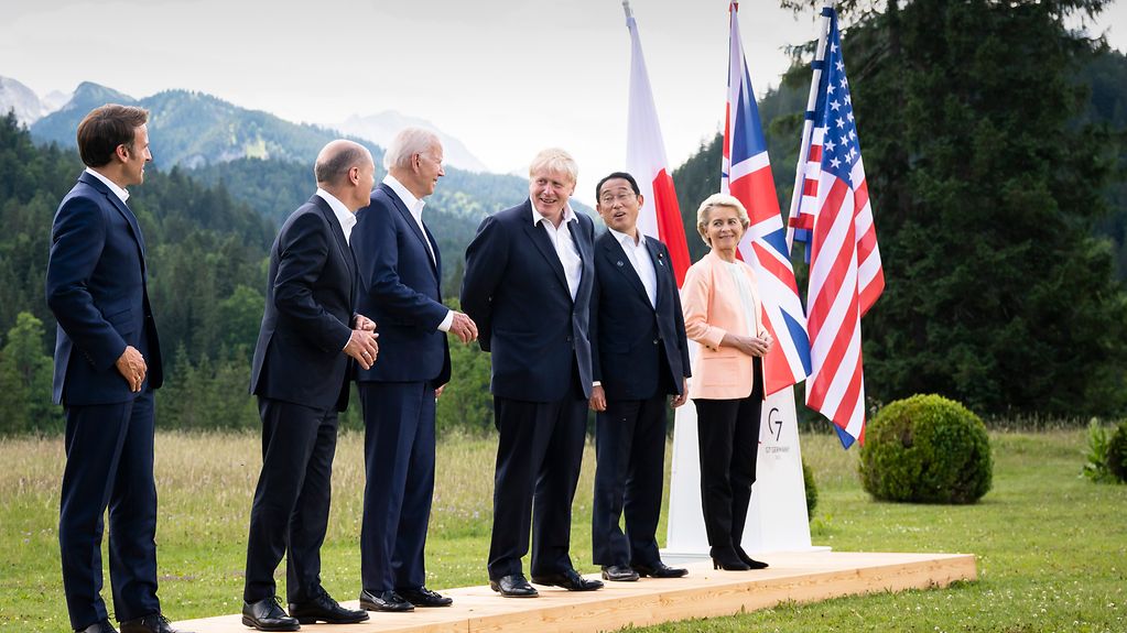G7 participants wait for the family photo to be taken.