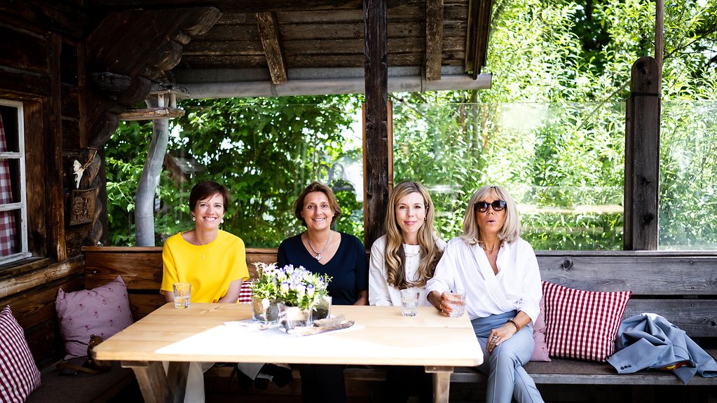 Amélie Derbaudrenghien, Britta Ernst, Carrie Johnson and Brigitte Macron in the Elmauer Alm mountain restaurant.