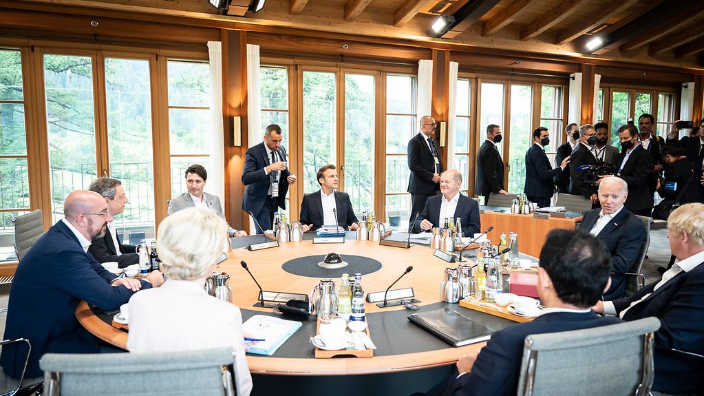 The G7 heads of state and government around the conference table at the start of the seventh working session.