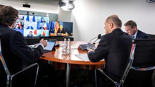 Bundeskanzler Olaf Scholz während einer Videokonferenz der G7.